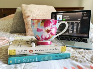 floral teacup on top of two books